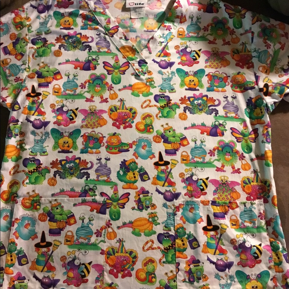 Halloween scrub top of cute monsters
